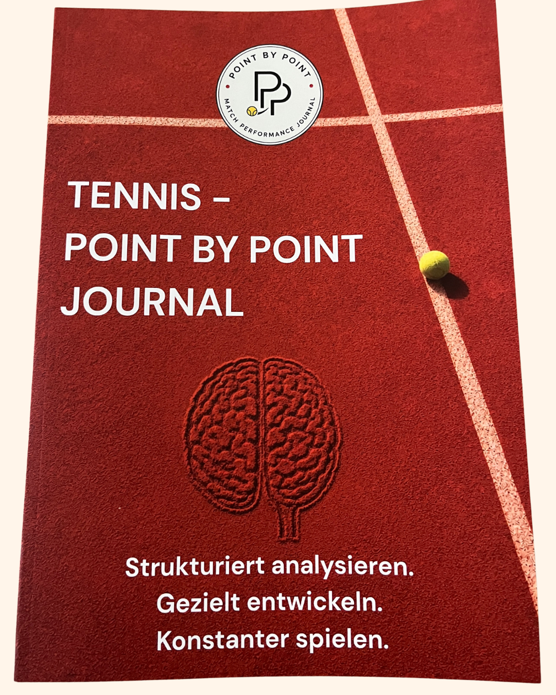 Point by Point Journal – Cover mit Gehirn-Motiv auf Sandplatz